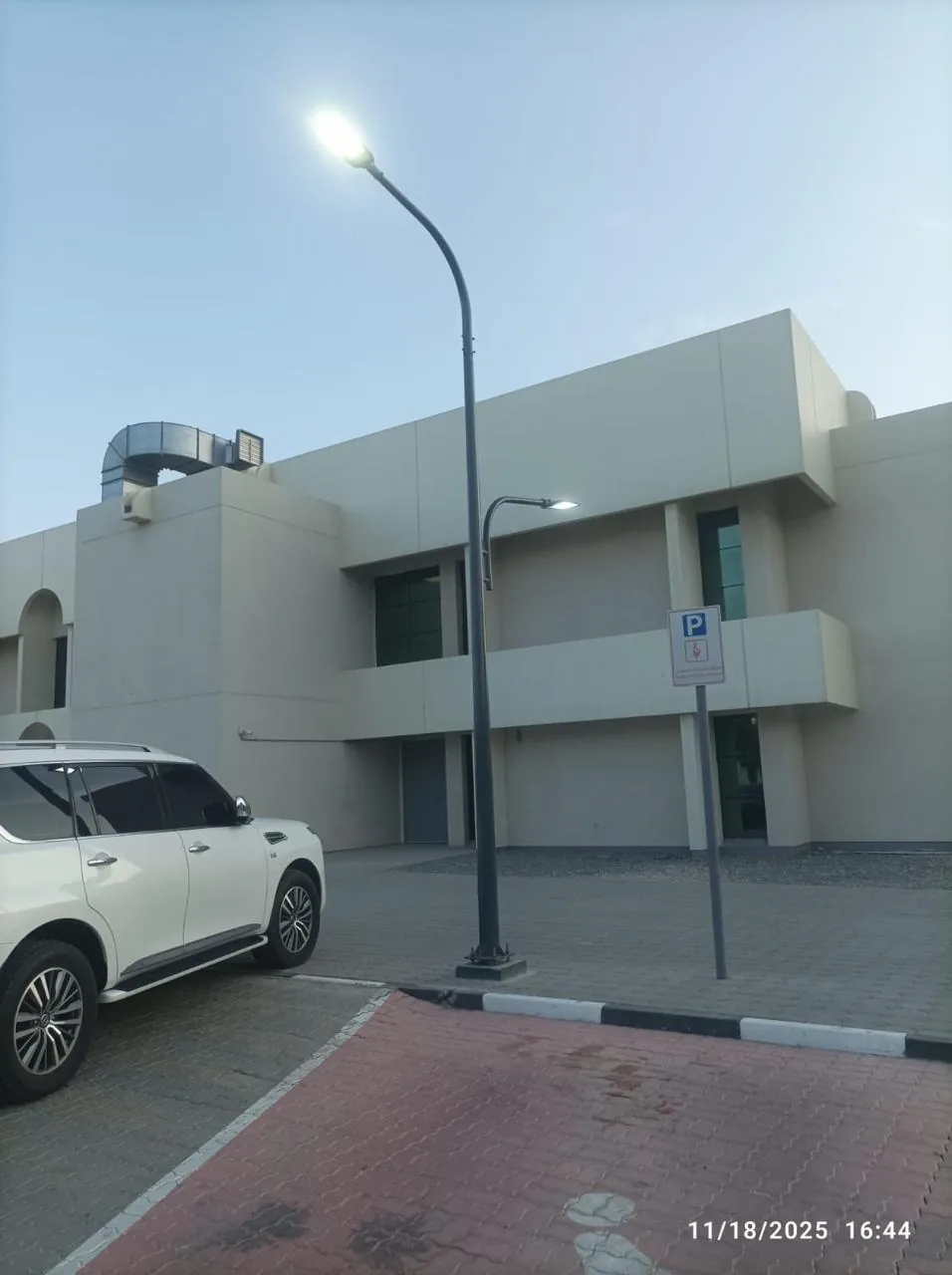Street lighting poles installed at boundary wall